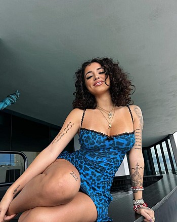 Malu Trevejo Stuns in a Seductive Little Dress, Flaunting Her Envy-Inducing Cleavage and Legs
